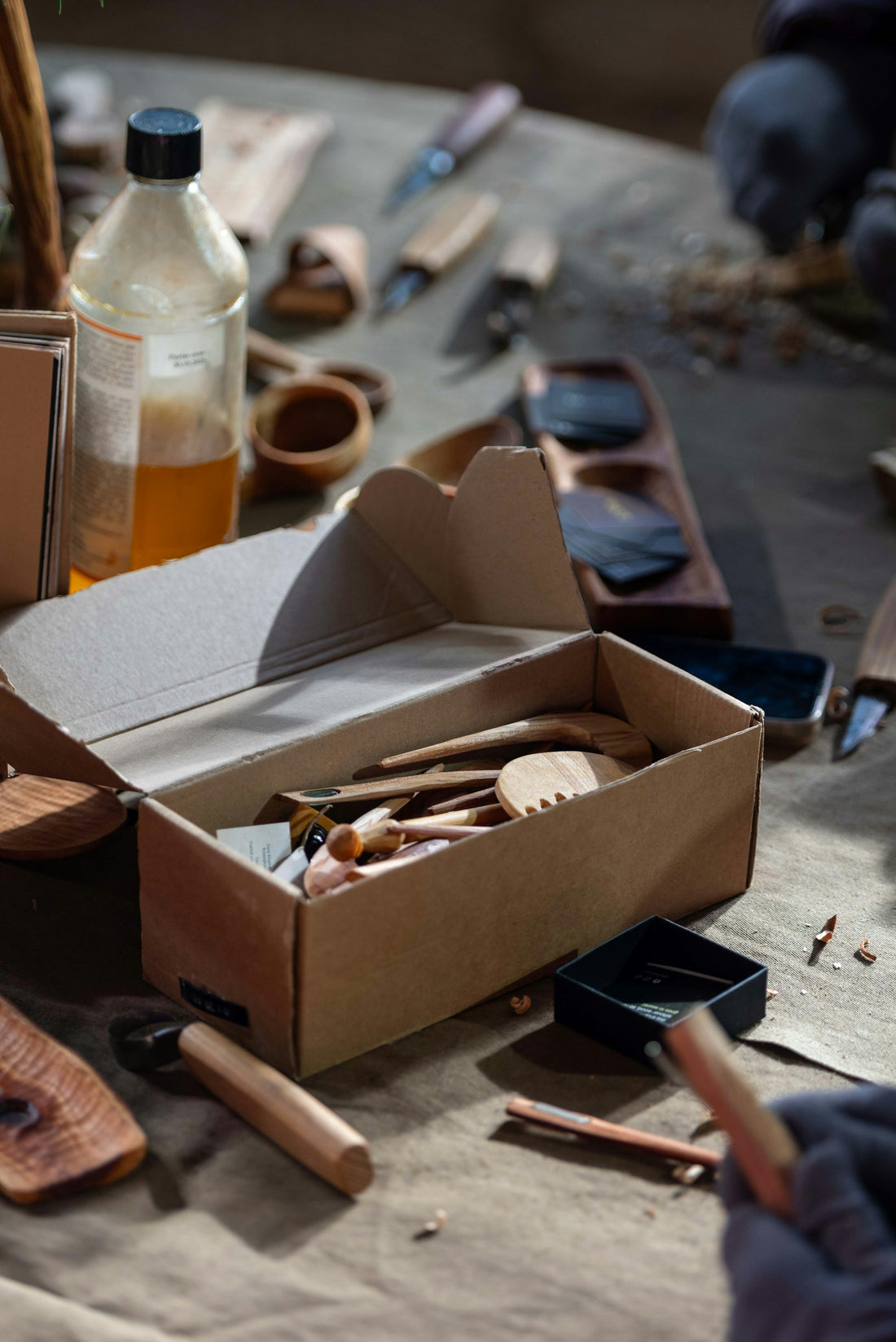 Wood carving tools and supplies on a table