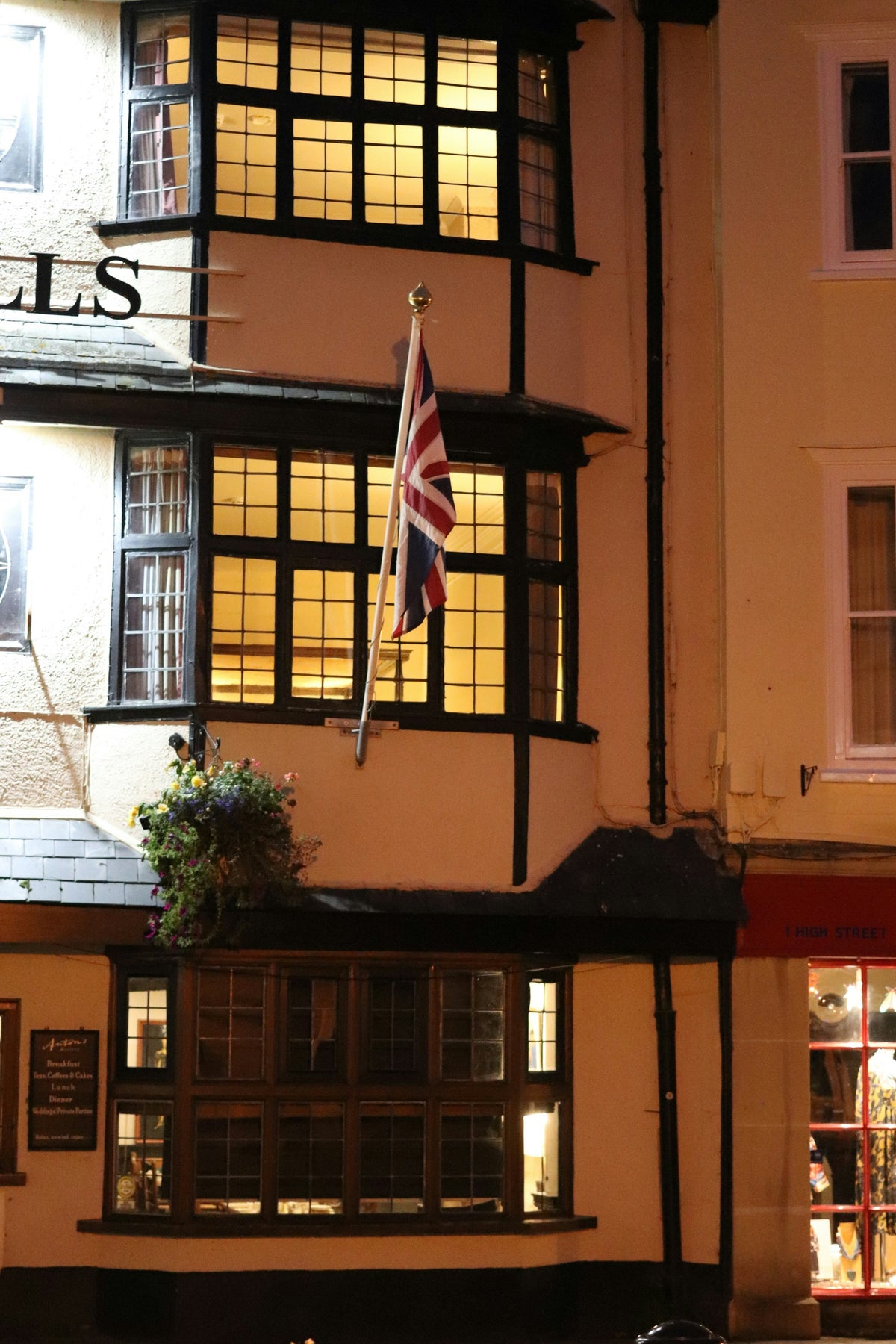 Traditional building with british flag at night