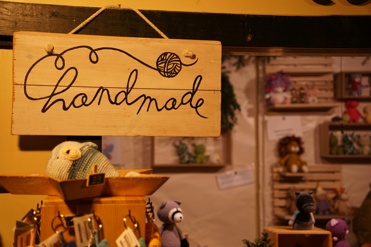 Wooden sign with handmade written on it