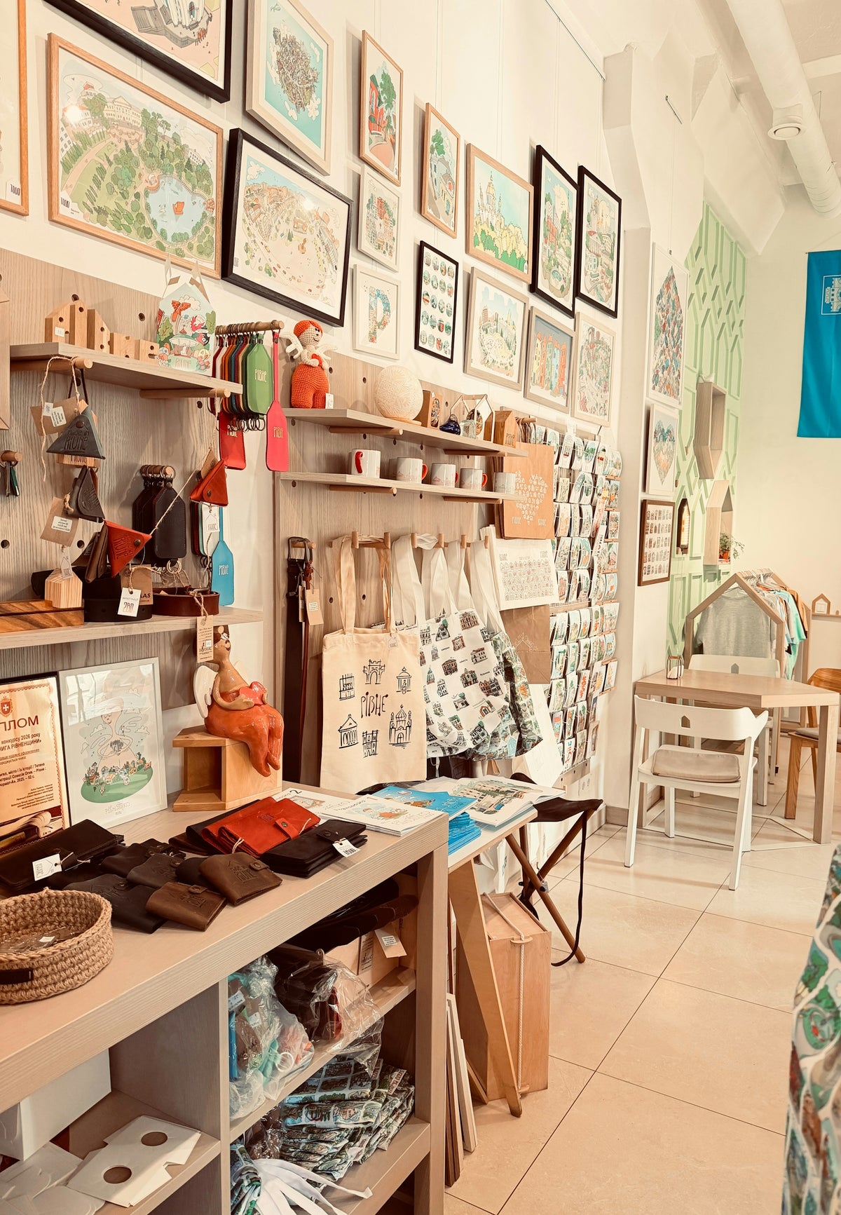 A cozy shop interior with handmade goods and framed artwork
