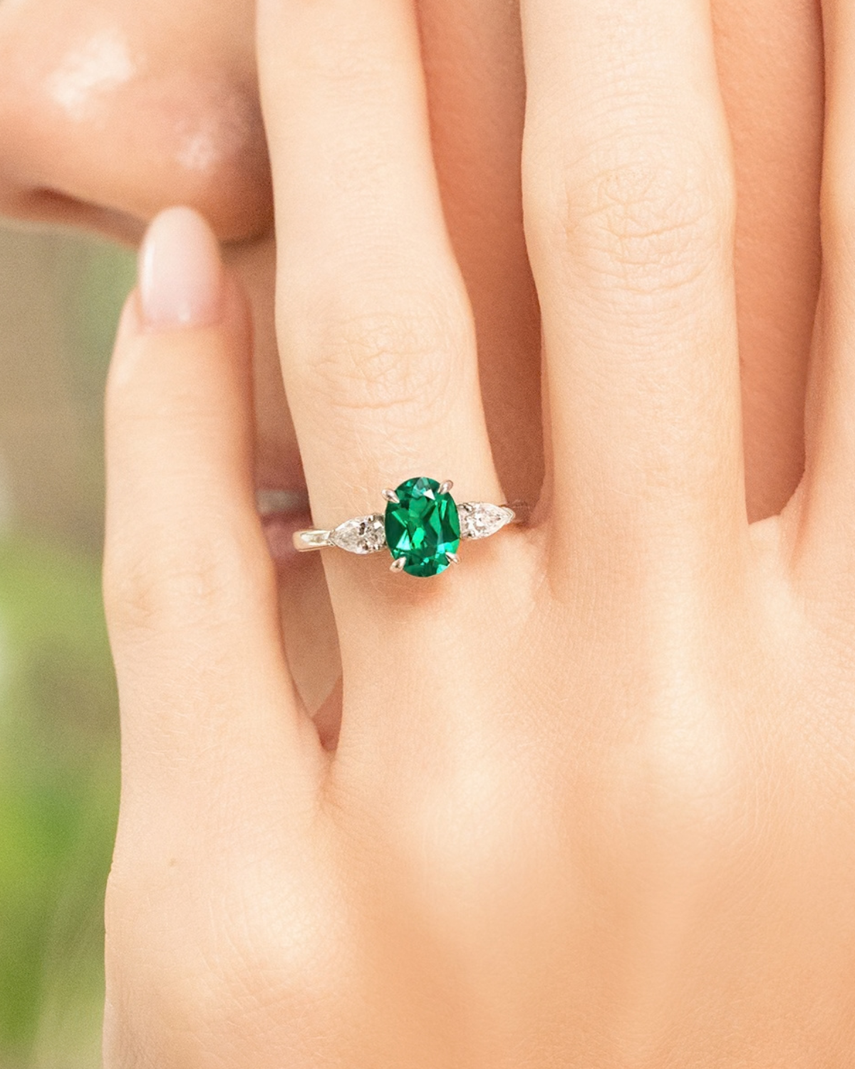 Emerald Oval Cut Three Stone Engagement Ring in Sterling Silver