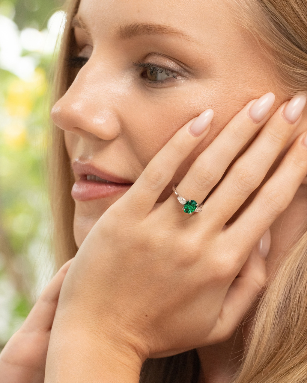 Emerald Oval Cut Three Stone Engagement Ring in Sterling Silver