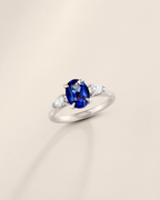 Blue Sapphire Oval Cut Three Stone Engagement Ring in Sterling Silver