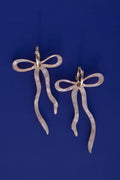 Pearlescent Beige Dangly Bow Hoop Earrings