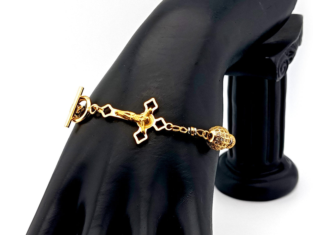 18K Gold cubic zirconia single decade rosary bracelet with gold plated Saint Benedict crucifix.