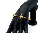 18K Gold cubic zirconia single decade rosary bracelet with gold plated Saint Benedict crucifix.
