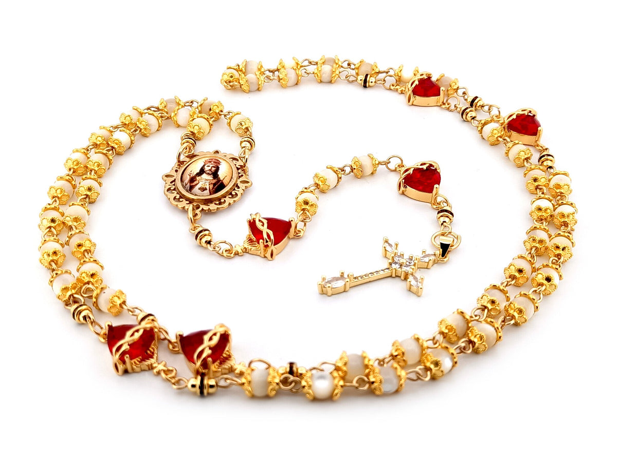 Christ the King mother of pearl and red crystal rosary beads with 18K gold plated cubic zirconia cross.
