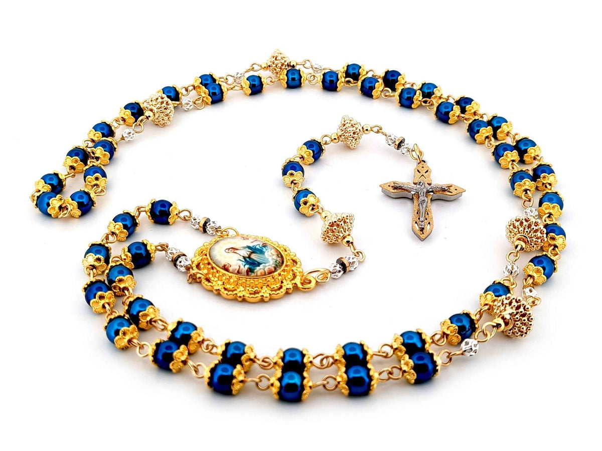 The Assumption of Mary blue hematite gemstone and gold rosary beads with layered stainless steel crucifix.
