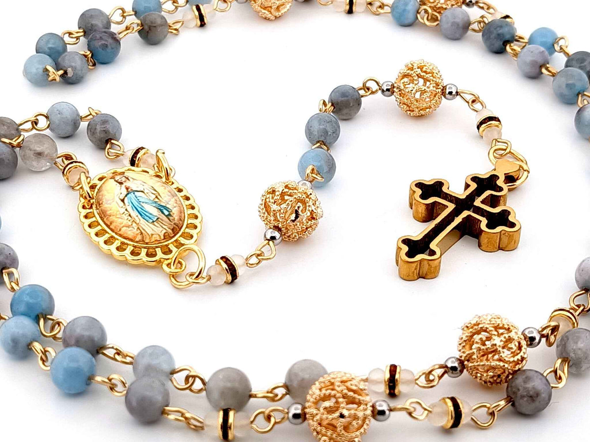 Immaculate Conception aqua marine gemstone and 18K gold rosary beads with gold plated 3D cross.