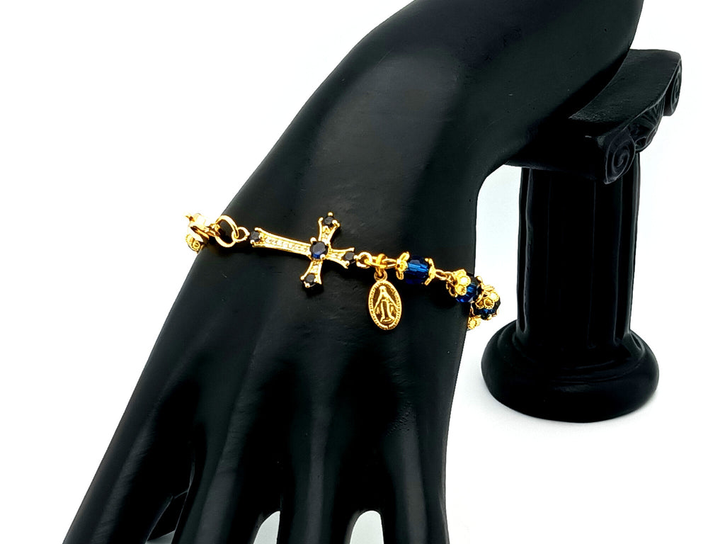 Miraculous medal blue Preciosa crystal single decade rosary bead bracelet with 18ct gold cubic zirconia cross.