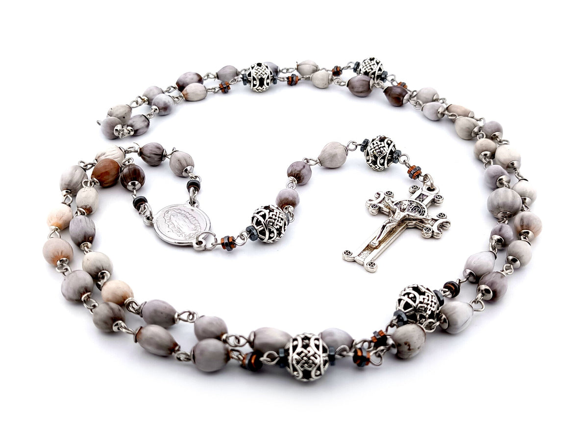 Our Lady of Guadalupe Jobs tears and silver rosary beads with Saint Benedict crucifix.