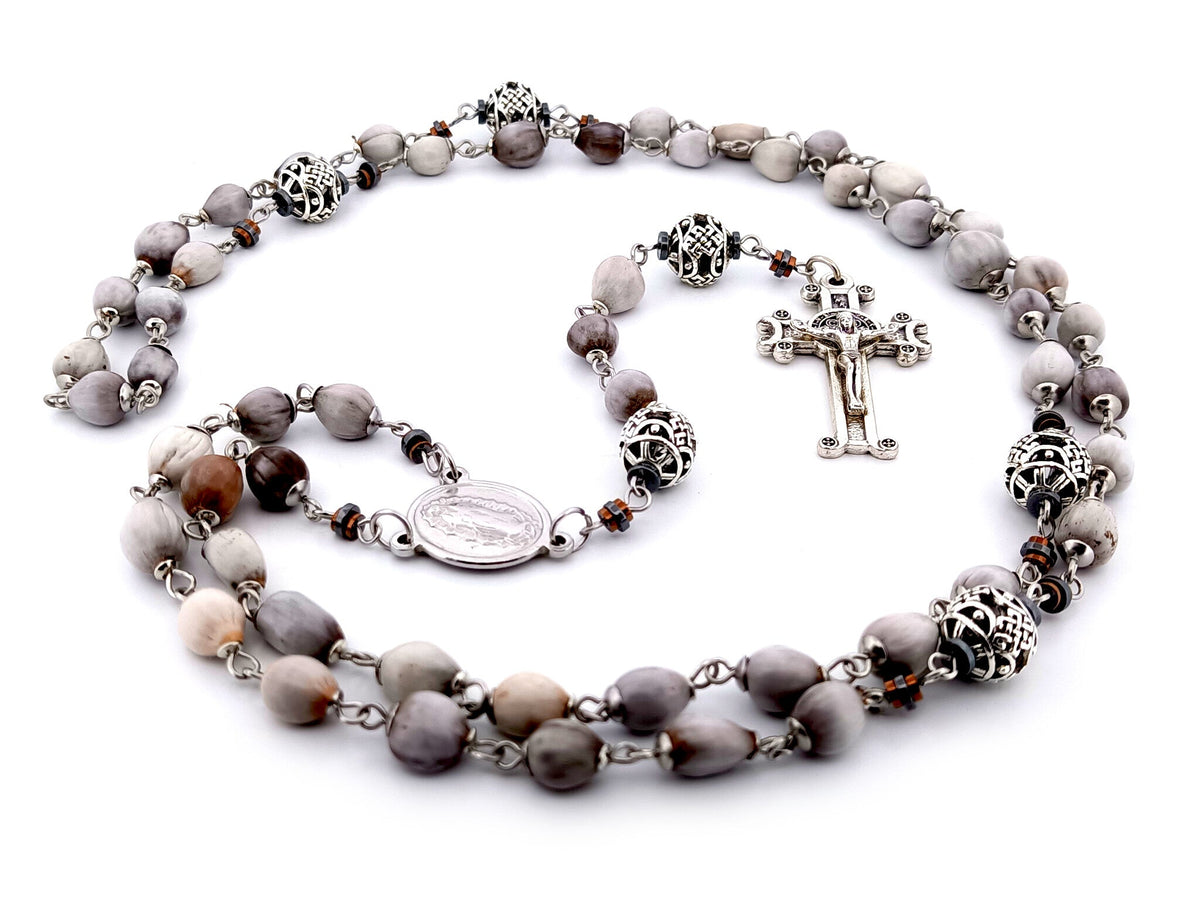 Our Lady of Guadalupe Jobs tears and silver rosary beads with Saint Benedict crucifix.