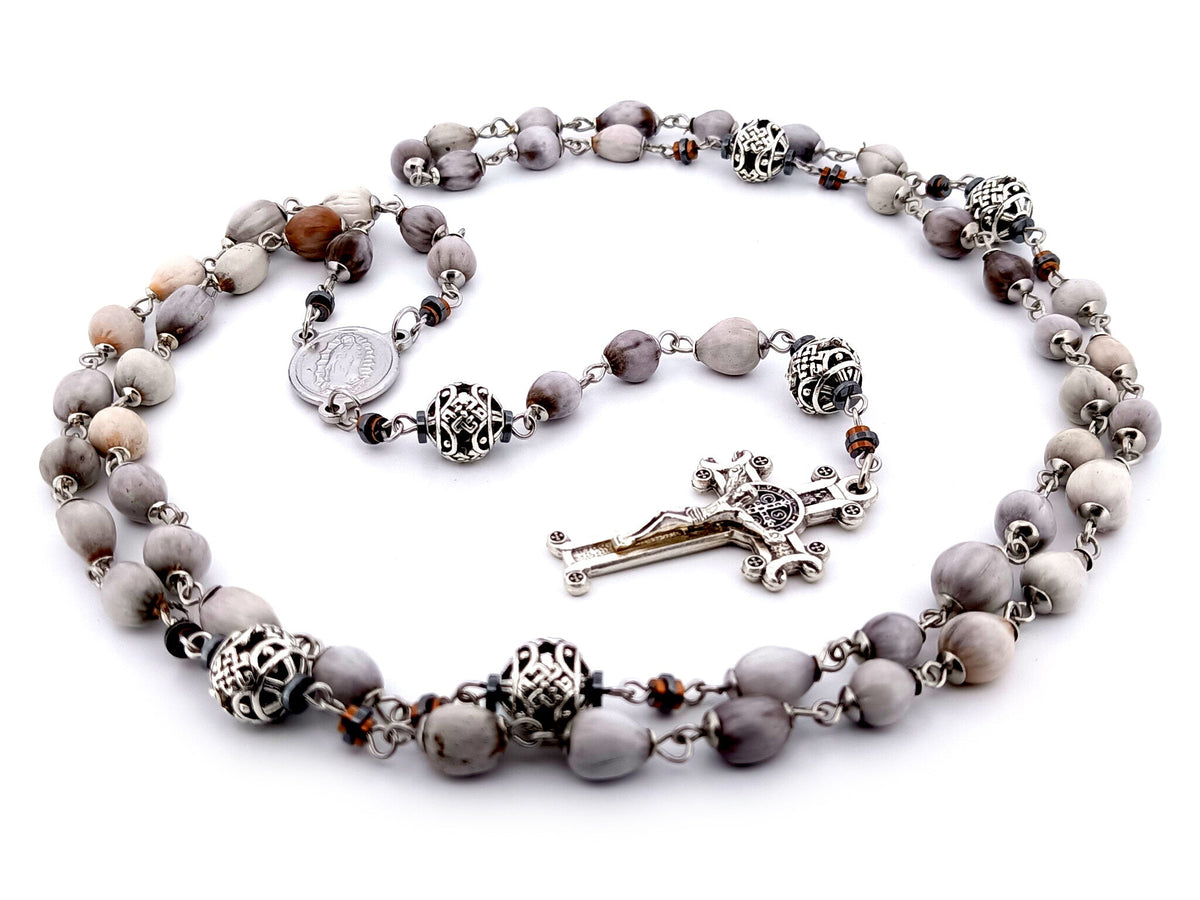 Our Lady of Guadalupe Jobs tears and silver rosary beads with Saint Benedict crucifix.
